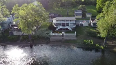 an aerial view of a house next to a river at The Riverfront in Easton