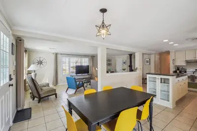 a kitchen and dining room with a table and chairs at The Riverfront in Easton