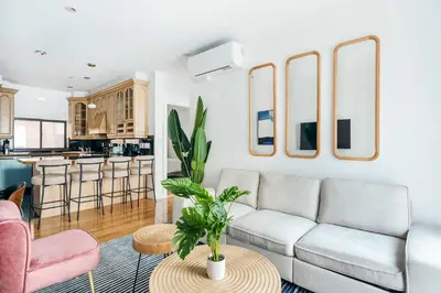 a living room with a couch and a table at 26A-2 Spacious brand new Fully Furnished 2-Bedroom in Prime Murray Hill Move-In Ready in New York