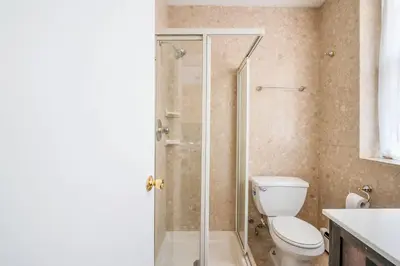 a bathroom with a toilet and a shower at 26A-2 Spacious brand new Fully Furnished 2-Bedroom in Prime Murray Hill Move-In Ready in New York