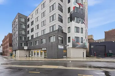 a tall building on a city street with a street at Cozy modern studio in prime area in Philadelphia
