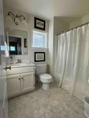 a bathroom with a toilet and a sink at Charming Farmhouse In Quarryville,PA in Quarryville