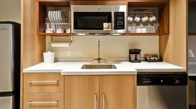 a kitchen with a sink and a microwave at Home2 Suites by Hilton in Mechanicsburg