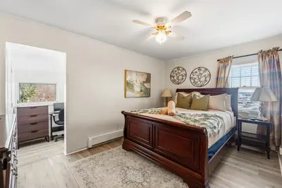 a bedroom with a bed and a ceiling fan at Family Retreat Near NYC w/ Parking & Views in Hackensack
