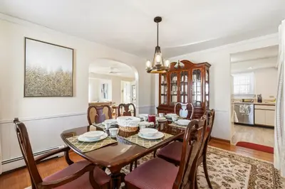 a dining room with a table and chairs at Family Retreat Near NYC w/ Parking & Views in Hackensack