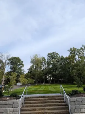 a set of stairs leading to a park with trees at Historic Barn - 2 Bedroom Apartment Close To Legoland NY in Goshen