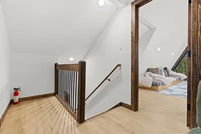 a staircase in a house with a mirror at Hot Tub Sauna Spacious Backyard Luxury in Jim Thorpe