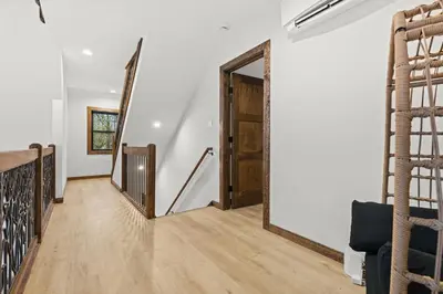 a hallway with a door and stairs in a house at Hot Tub Sauna Spacious Backyard Luxury in Jim Thorpe