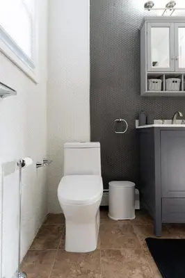 a bathroom with a white toilet and a sink at 17m to NYC,5 min to American Dream,2Parking Spaces in Carlstadt