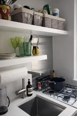 a kitchen sink with a pot on a stove at Chic West Village Studio on Bleecker Street in New York