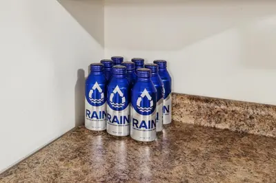 a group of blue bottles sitting on a counter at Heaven in Newark