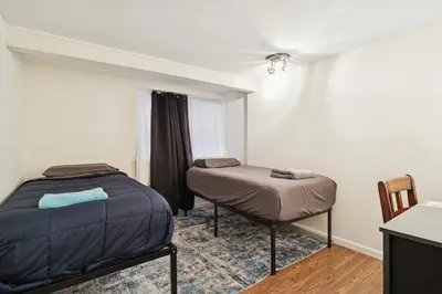 a room with a bed and a chair in it at Heaven in Newark