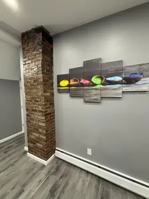 a room with four paintings on the wall at The loft 2 bedroom apartment in Newark