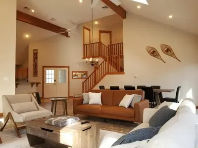a living room with a couch and a table at Cozy 4bd 4bath Grand Cabin Retreat in Camelback in Tannersville