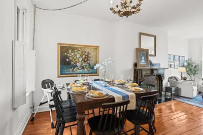 a dining room with a table and chairs at Riverfront Gem with Balcony, Patio and City Views in Harrisburg