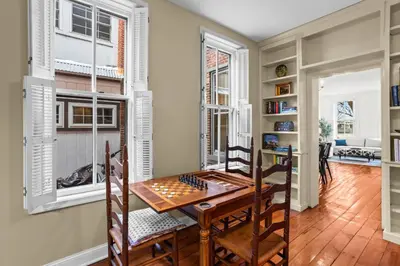 a dining room with a chess board on a table at Riverfront Gem with Balcony, Patio and City Views in Harrisburg