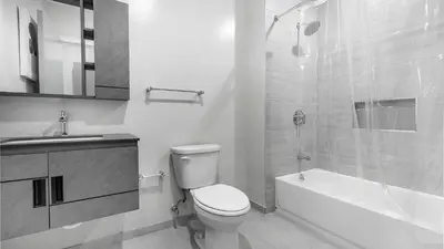 a bathroom with a toilet and a sink and a shower at Landing Modern 2BD Gym in Philadelphia