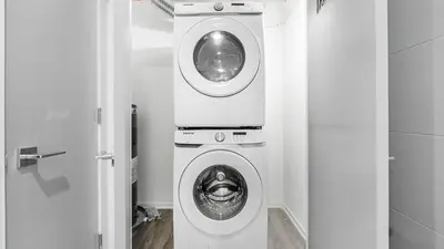 a washer and dryer in a small room at Landing Modern 2BD Gym in Philadelphia