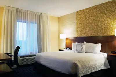 a hotel room with a bed and a window at Fairfield Inn & Suites by Marriott Stroudsburg Bartonsville/Poconos in Stroudsburg