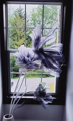 a window with a bunch of flowers in a vase at Creekside Family Dreamland - Hot Tub, Firepit, Arcade in Pocono Summit