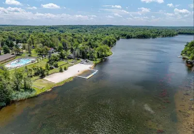 an aerial view of a river with a resort at Spacious Vacation Home Tobyhanna Gym BBQ Boat in Pocono Country Place