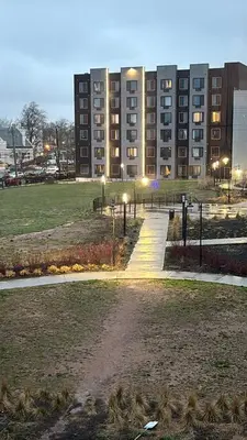 a large building with a park in front of it at Nice escape 8 min from EWR in Elizabeth