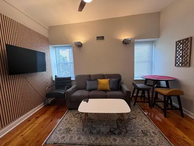a living room with a couch and a table at 3961 Baltimore Penn Campus in Philadelphia