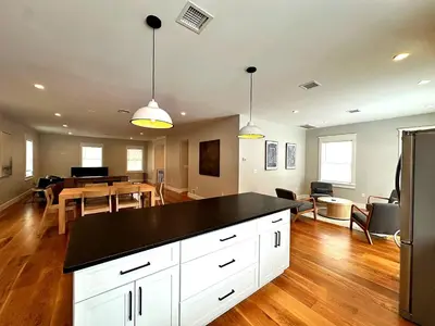 a kitchen and living room with a dining room at Luxury 3BR with King Beds in Montgomery Village in Montgomery