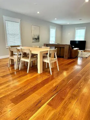 a dining room with a wooden table and chairs at Luxury 3BR with King Beds in Montgomery Village in Montgomery