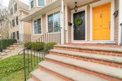 a front door of a house with a yellow door at Princeton Einstein Boutique Stay in Princeton