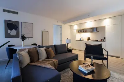 a living room with a couch and a table at Elegant NYC Haven Walk to Broadway in New York