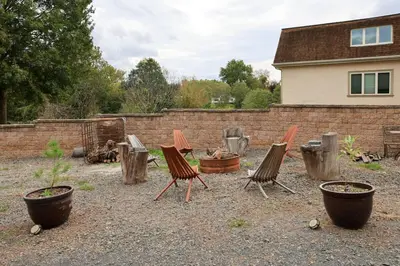 a group of chairs sitting in a yard at Bucks County Home Farm Philadelphia Dog Friendly in Warminster