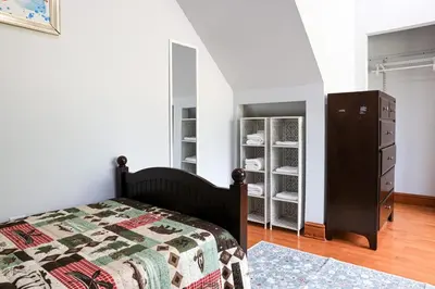 a bedroom with a bed and a dresser at Bucks County Home Farm Philadelphia Dog Friendly in Warminster