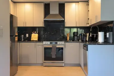 a kitchen with white cabinets and an oven at Bucks County Home Farm Philadelphia Dog Friendly in Warminster