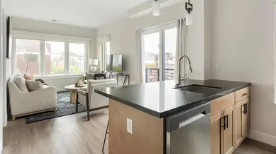a kitchen with a sink and a living room at Landing Spectacular 1BD Clubhouse Gym in Philadelphia
