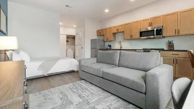a living room with a couch and a bed at Landing Spectacular 1BD Clubhouse Gym in Philadelphia