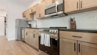 a kitchen with a stove and a microwave at Landing Spectacular 1BD Clubhouse Gym in Philadelphia