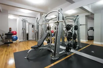 a gym with cardio equipment in a room at Blueground Murray Hill fitness center nr Bryant Park NYC-2171 in New York