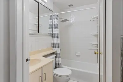 a bathroom with a toilet and a sink and a shower at Stylish Studio in Central Park in Best Location Ever in New York
