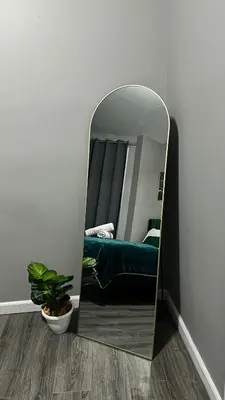 a mirror in the corner of a room with a bed at Cozy Stay with Games, 15 min to NYC, Private Backyard - Sleeps 6 - NEAR METLIFE STADIUM in Jersey City