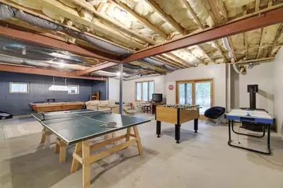 a large room with a ping pong table in it at Spacious Lake Front Winter Retreat! Less than 10 Min to Big Boulder! in Blakeslee