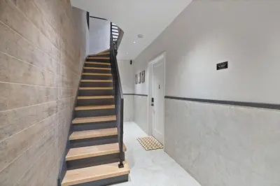 a staircase in a house with wooden steps at Luxury Brand New 3BED Gem 20 Minutes to NYC in Jersey City
