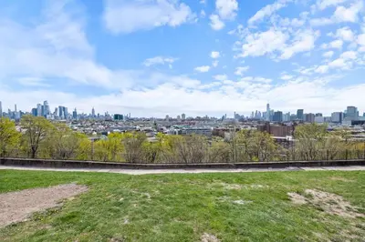 a view of the city from a park at New Luxury and Chic 3BR 2BA Apartment 20 Minutes to NYC in Jersey City