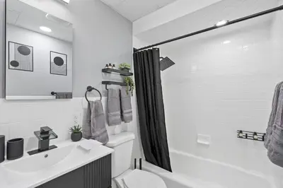 a bathroom with a toilet and a sink and a shower at New and Beautiful 2BR Apt in Prime Spot 20 Min to NYC in Jersey City
