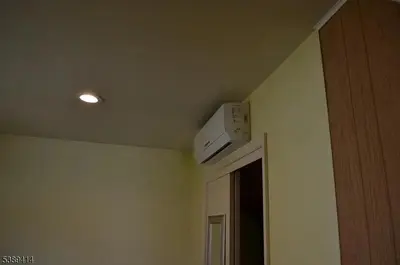 a air conditioner on the ceiling of a room at Single Family Homes Dunelle in Dunellen