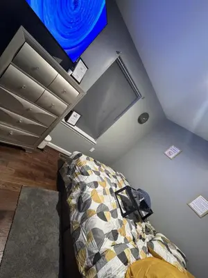 a room with a couch and a blue ceiling at Cozy 3-Bedroom Apartment in Newark near NYC in Newark