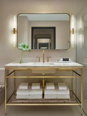 a bathroom with a sink and a mirror at 11 Howard, New York, a Member of Design Hotels in New York