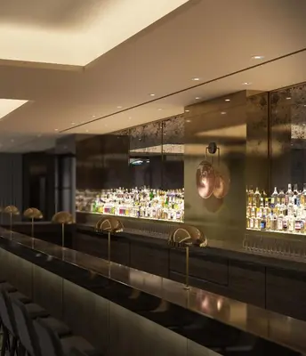 a bar with a lot of liquor bottles at 11 Howard, New York, a Member of Design Hotels in New York