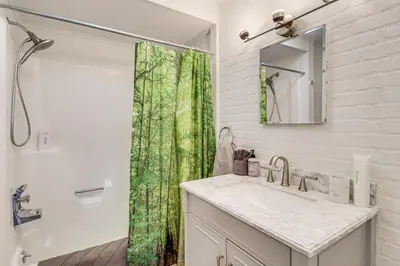 a bathroom with a sink and a shower at Vibrant Hideaway on Shores of West Emerald Lake! in Long Pond