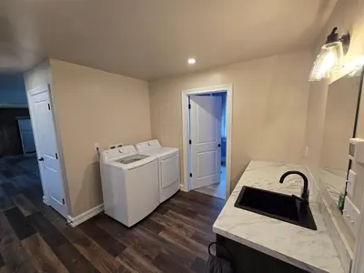 a laundry room with a washer and dryer in it at Just Like Home, Overlooks Maple Grove Raceway in Mohnton